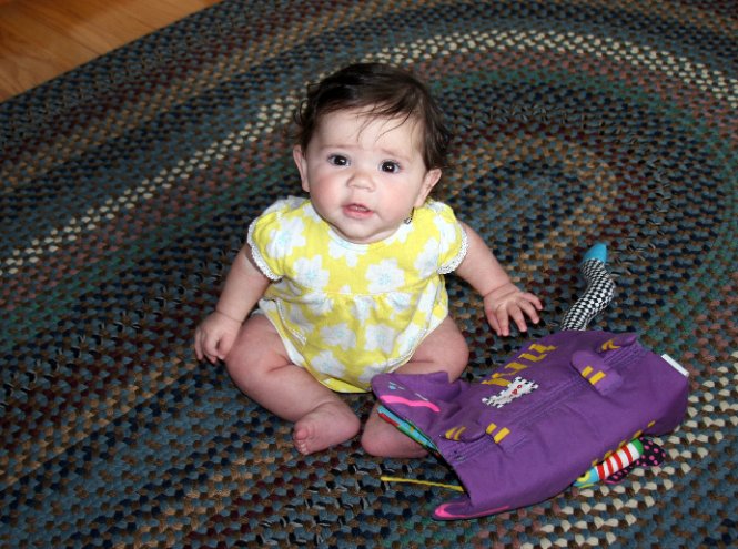 Julia sits up by herself